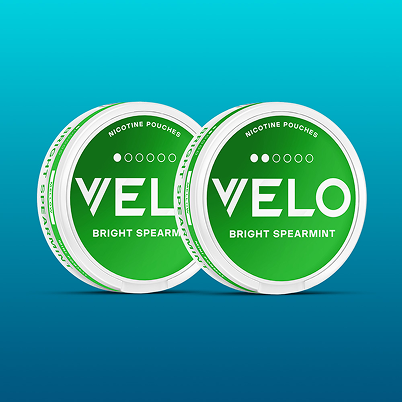 Velo Nicotine Pouches |  Two green and white VELO Bright Spearmint nicotine pouches containers are shown overlapping on a blue gradient background.