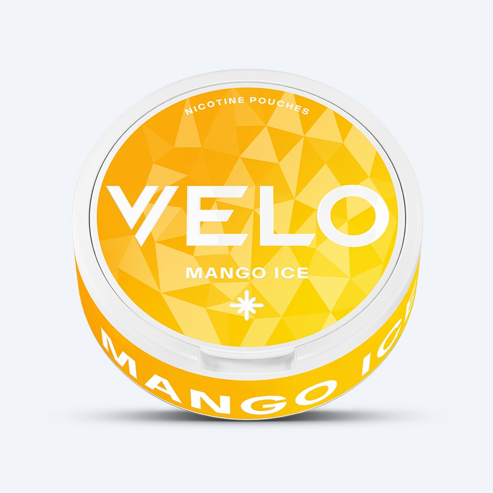 Velo Nicotine Pouches |  A round container of VELO Mango Ice nicotine pouches features a vibrant yellow lid with a geometric design and bold white text. The prominent VELO and Mango Ice branding highlights the refreshing cooling sensation combined with the intense flavor of tangy mango in every pouch.