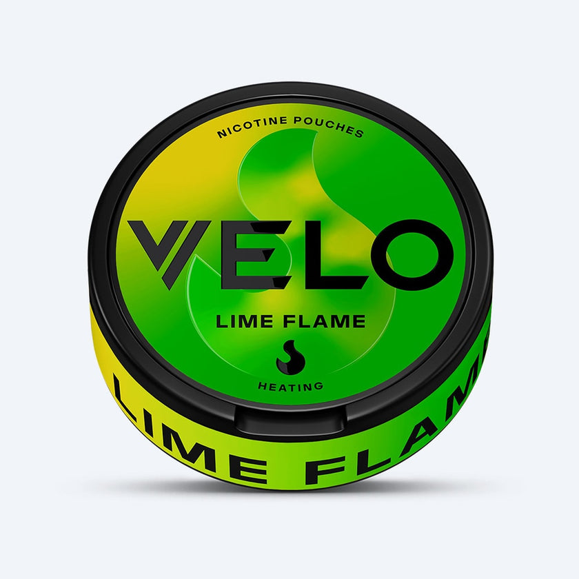 Velo Nicotine Pouches |  The VELO Lime Flame nicotine pouches come in a round container featuring a vibrant green and yellow design with bold black text and a flame icon to highlight its heated sensation. Infused with an aromatic jalapeno twist, Lime Flame delivers a zesty kick—perfect for those seeking a spicy jalapeno experience in every pouch.