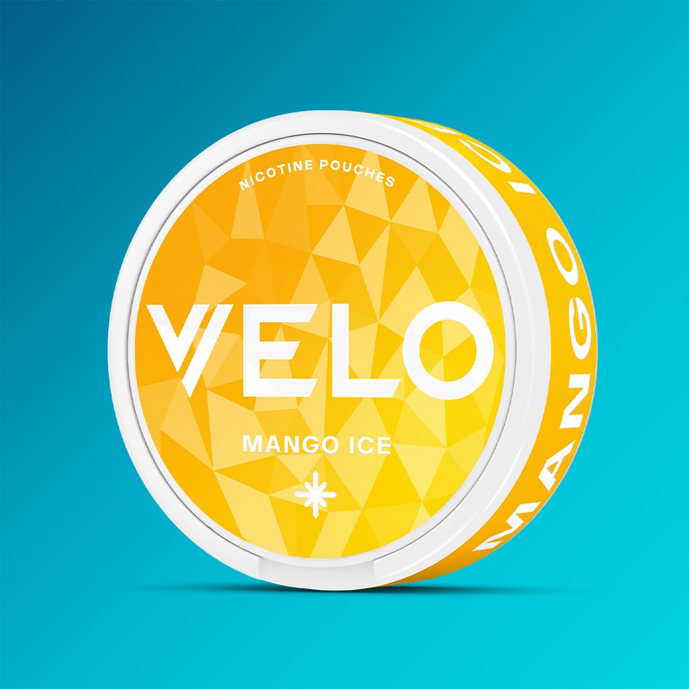 Velo Nicotine Pouches |  A round container of VELO Mango Ice nicotine pouches features a yellow geometric pattern set against a blue background. The lid prominently displays the “VELO” brand name and the product name, “Mango Ice,” highlighting its vibrant mango taste with a cool, refreshing sensation.