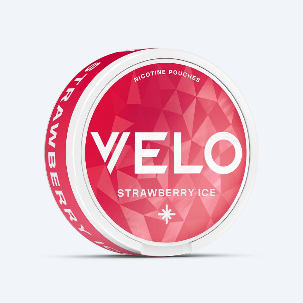 Velo Nicotine Pouches |  A round white container labeled VELO Strawberry Ice, featuring a red geometric design and the word STRAWBERRY on the side, contains fruity nicotine pouches.
