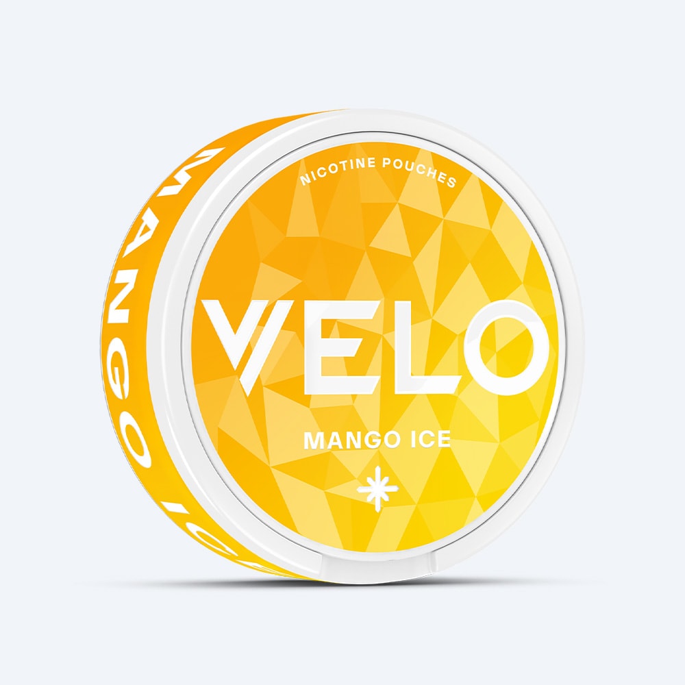Velo Nicotine Pouches |  A round container in white and yellow, branded as VELO Mango Ice, features a geometric design and is labeled as a nicotine pouch product. The side displays "Mango Ice" in white text on a yellow background, suggesting the tangy flavor of mango combined with a refreshing cooling sensation.