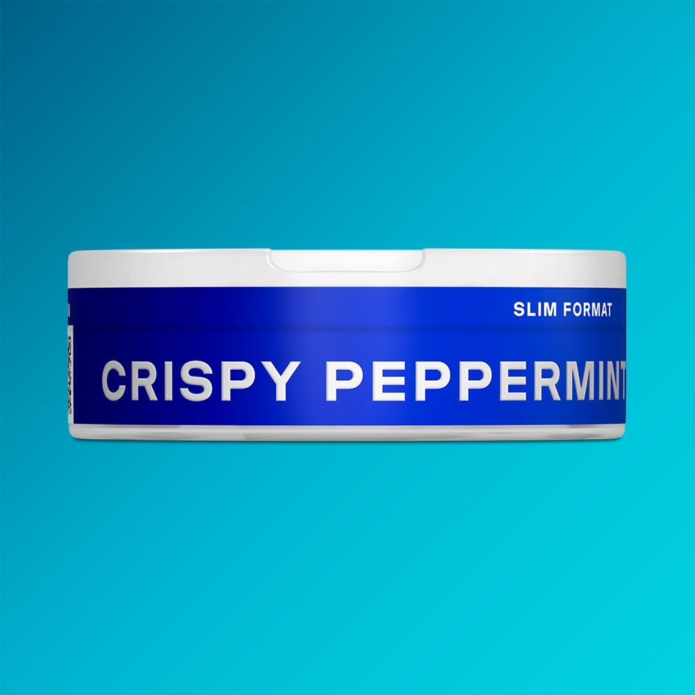 Velo Nicotine Pouches |  A round VELO container, featuring the Crispy Peppermint label in blue and white, rests against a gradient turquoise background, capturing the cool and invigorating essence of peppermint.