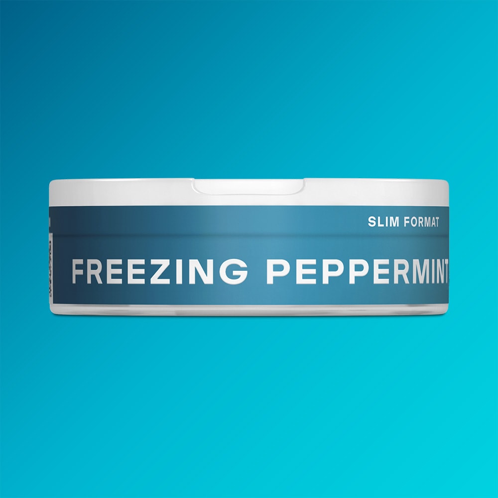Velo Nicotine Pouches |  A round white and blue VELO container with the product name "Freezing Peppermint" displayed in bold letters and "Slim Format" on the side, set against a blue gradient background, suggesting an intense menthol experience.