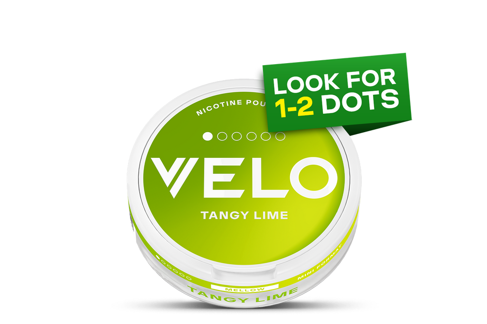 Velo Nicotine Pouches |  A round container labeled “VELO TANGY LIME” with a lime green gradient and the words “LOOK FOR 1-2 DOTS” in a green box above the lid. Five small white circles appear above the VELO text, indicating the nicotine strength of these convenient Velo pouches.
